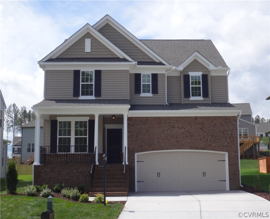 10875 Holman Ridge Road Glen Allen, VA 23059 - Photo 1 of 17 a front view of a house with garden