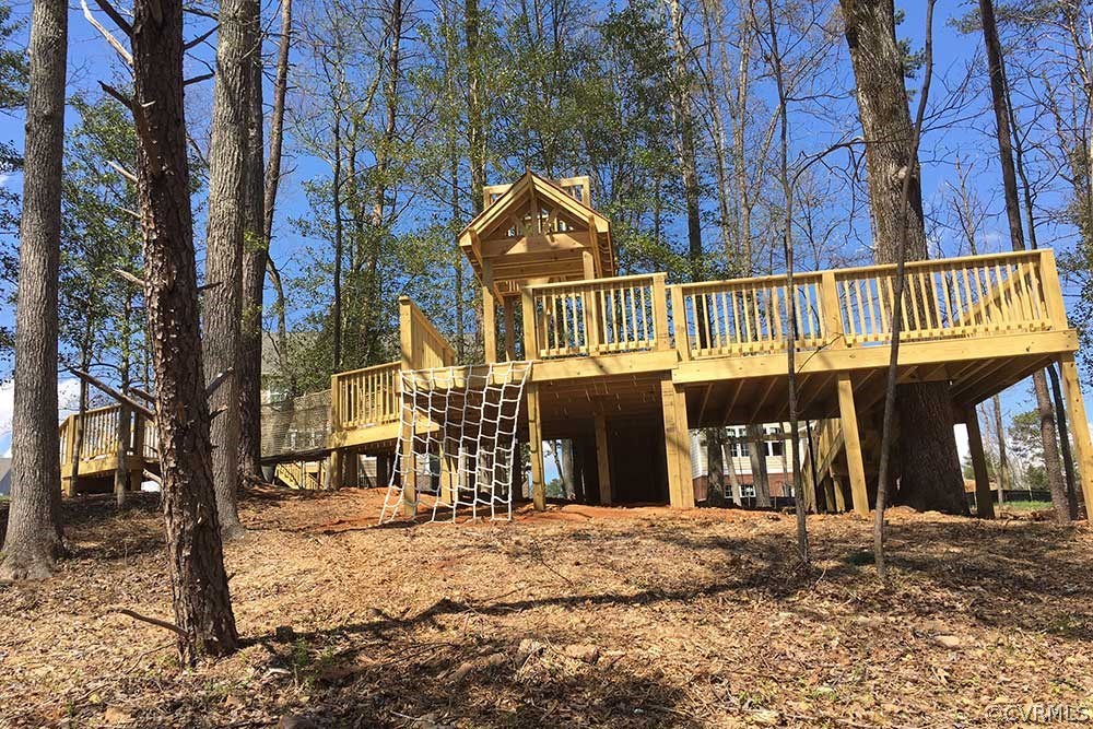 10875 Holman Ridge Road Glen Allen, VA 23059 - Photo 10 of 17 a view of a house with large trees next to a road