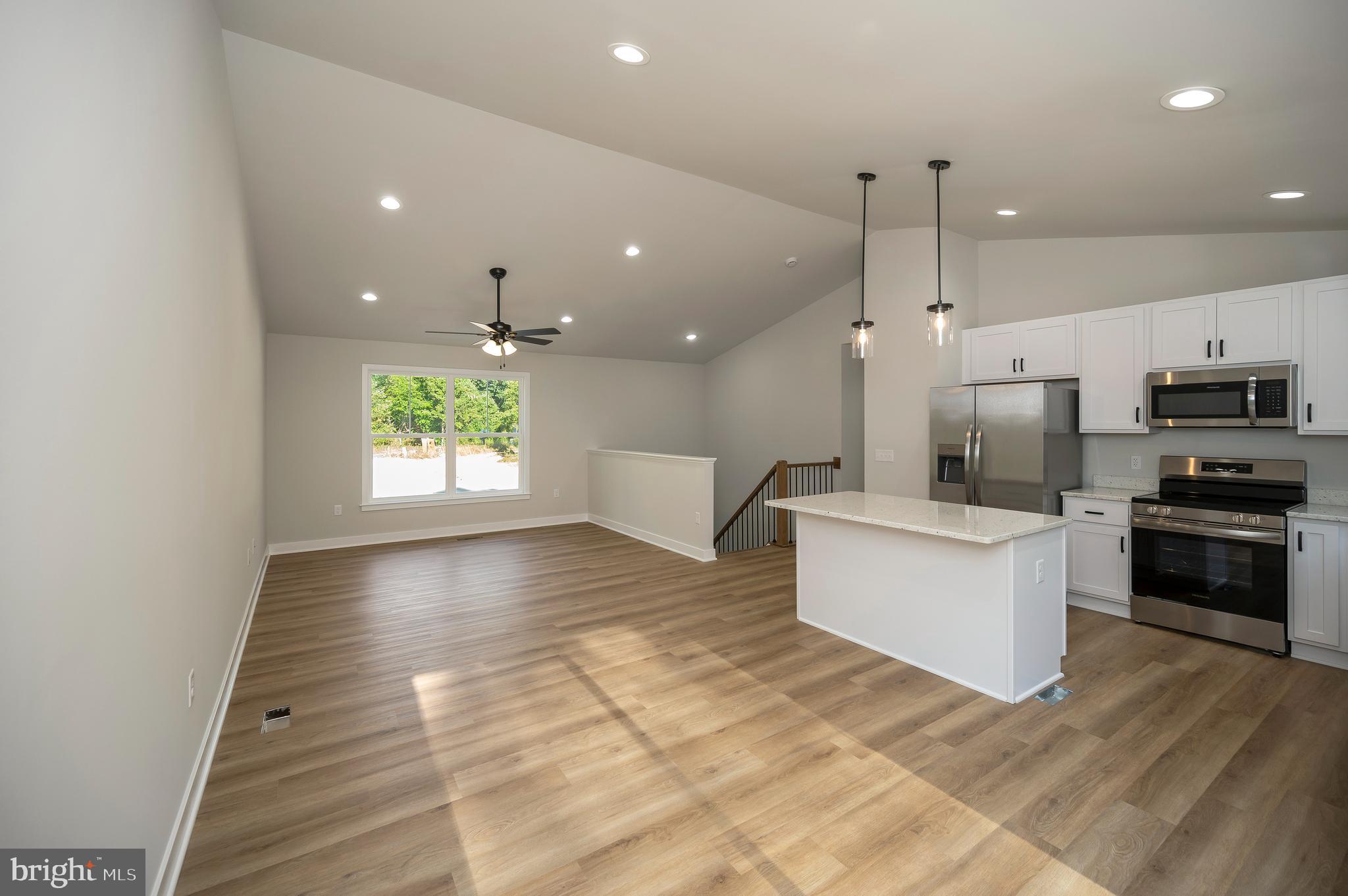 3153 Lewiston Road Bumpass, VA 23024 - Photo 13 of 45 a view of kitchen with kitchen island stainless steel appliances a stove a sink and a window