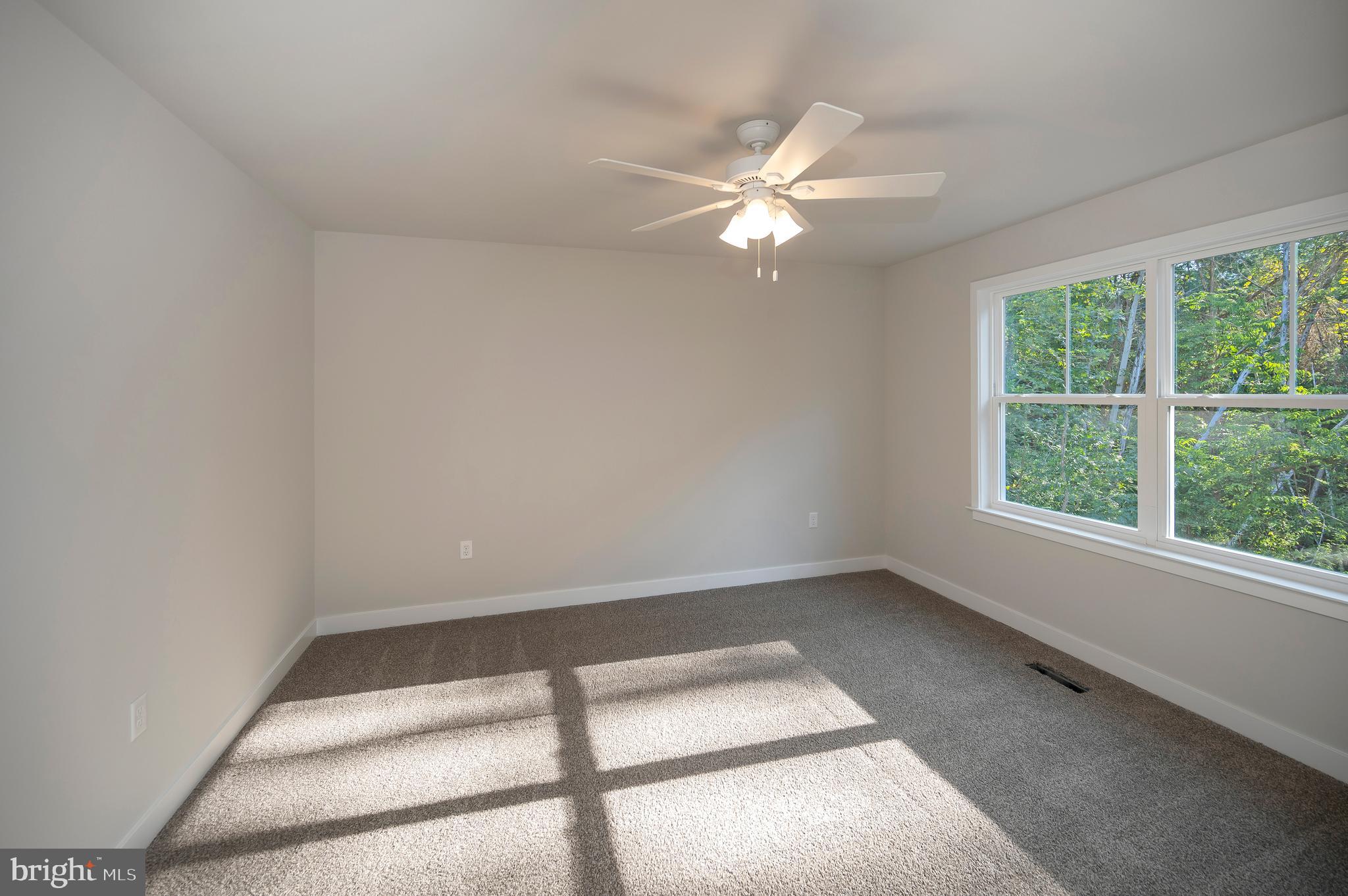 3153 Lewiston Road Bumpass, VA 23024 - Photo 8 of 45 an empty room with a window