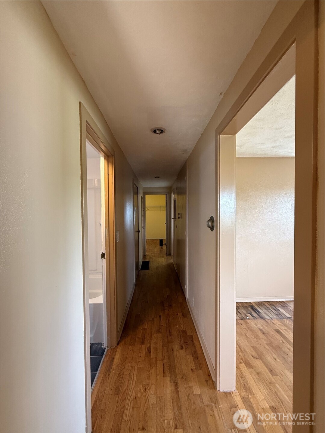 306 South Adams Street Waterville, WA 98858 - Photo 12 of 25 a view of a hallway with wooden floor