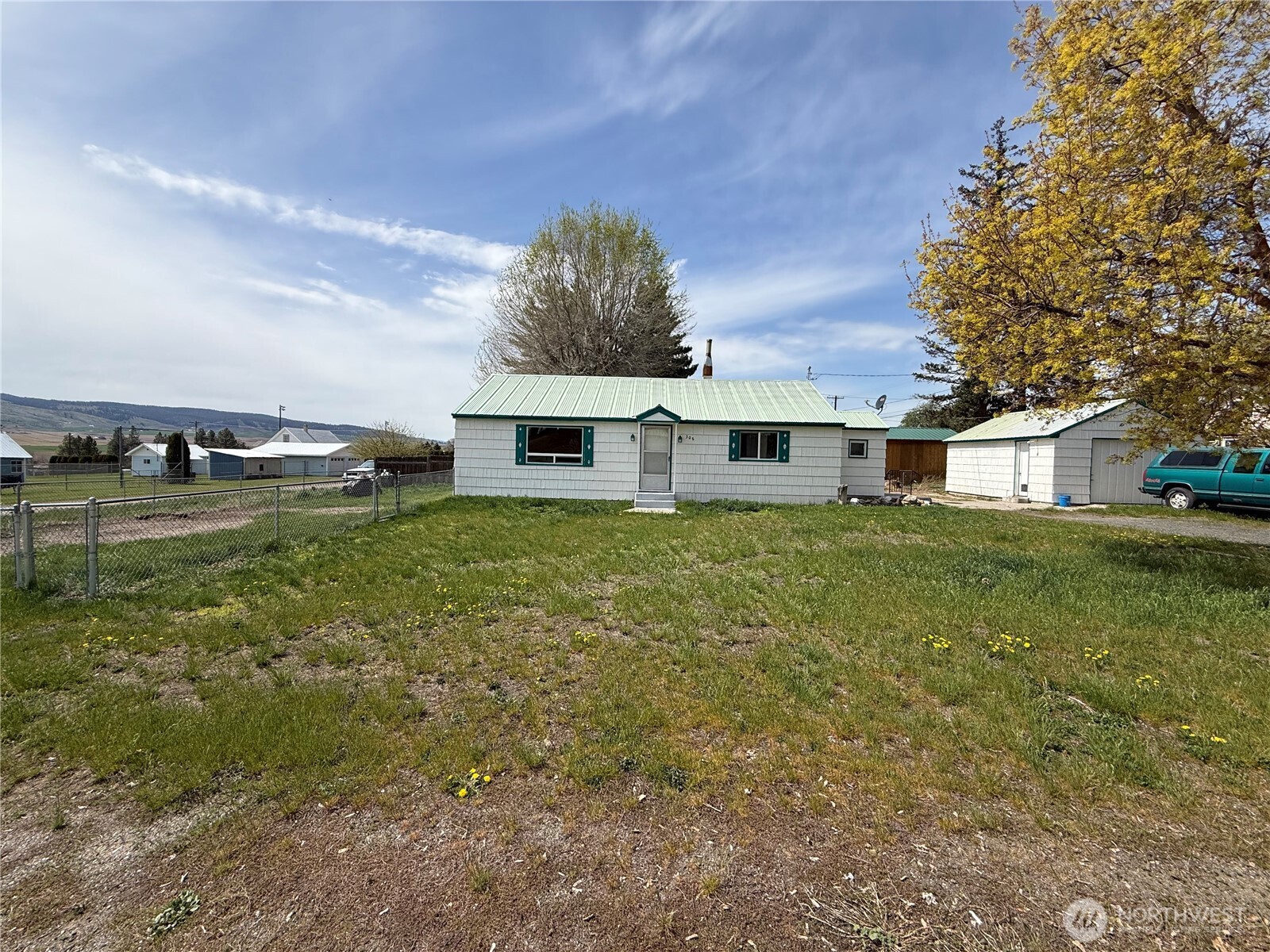 306 South Adams Street Waterville, WA 98858 - Photo 2 of 25 a view of a house with a yard