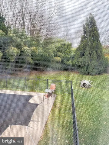 a view of swimming pool with a backyard