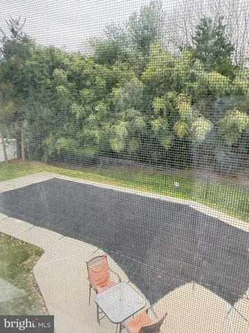 a view of pool with outdoor seating