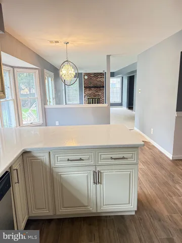 a stove top oven sitting inside of a kitchen