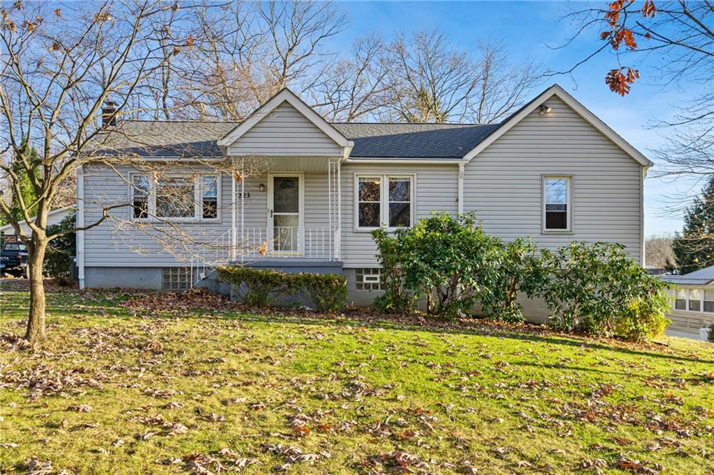 223 Oak Road Pittsburgh, PA 15239 - Photo 1 of 25 a front view of a house with a yard