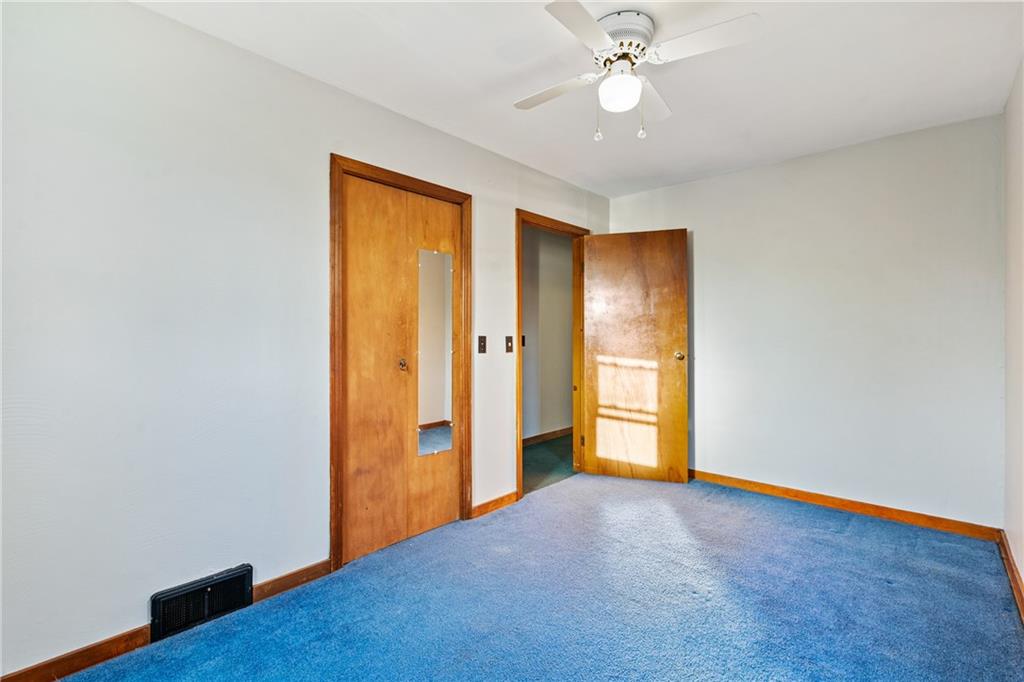 223 Oak Road Pittsburgh, PA 15239 - Photo 17 of 25 an empty room with closet and wooden floor