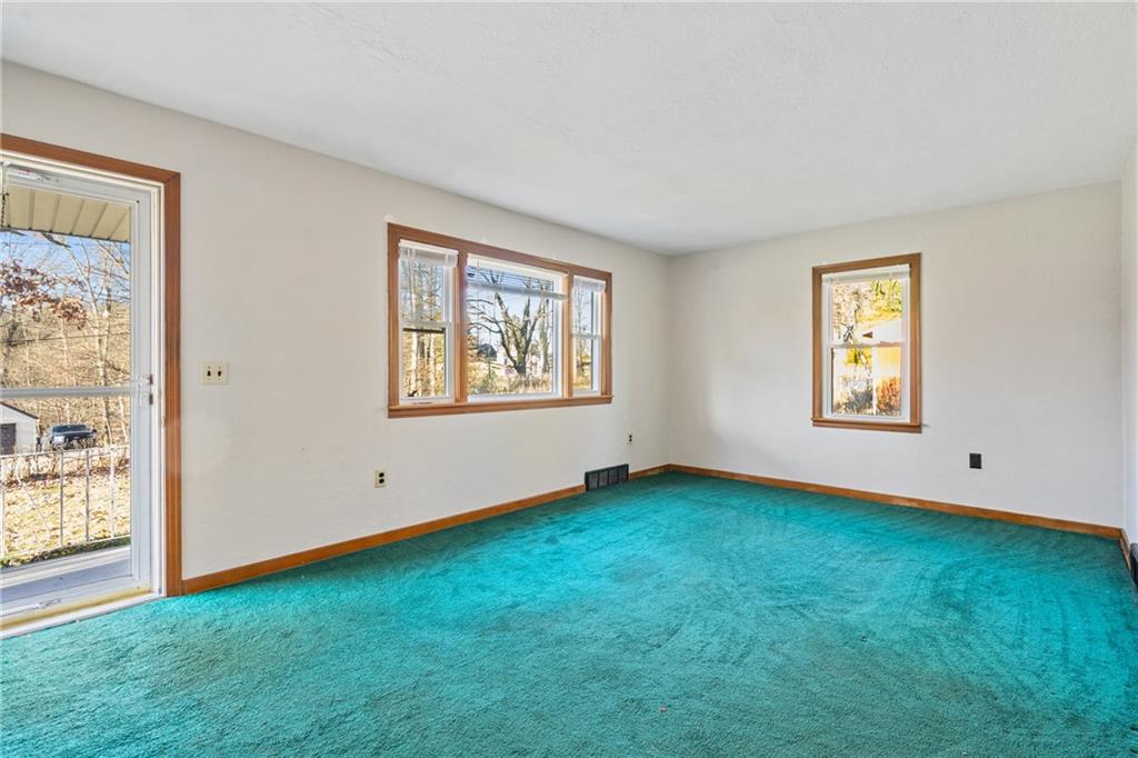 223 Oak Road Pittsburgh, PA 15239 - Photo 2 of 25 a view of an empty room with windows