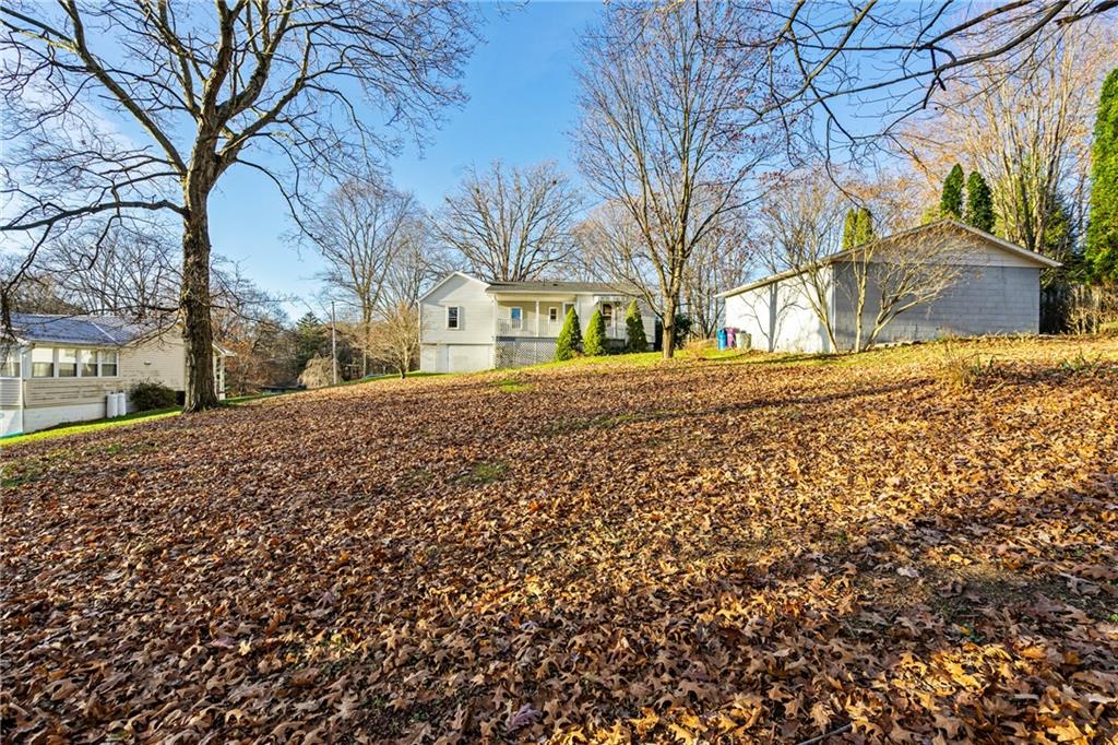 223 Oak Road Pittsburgh, PA 15239 - Photo 23 of 25 a view of a yard with a large tree