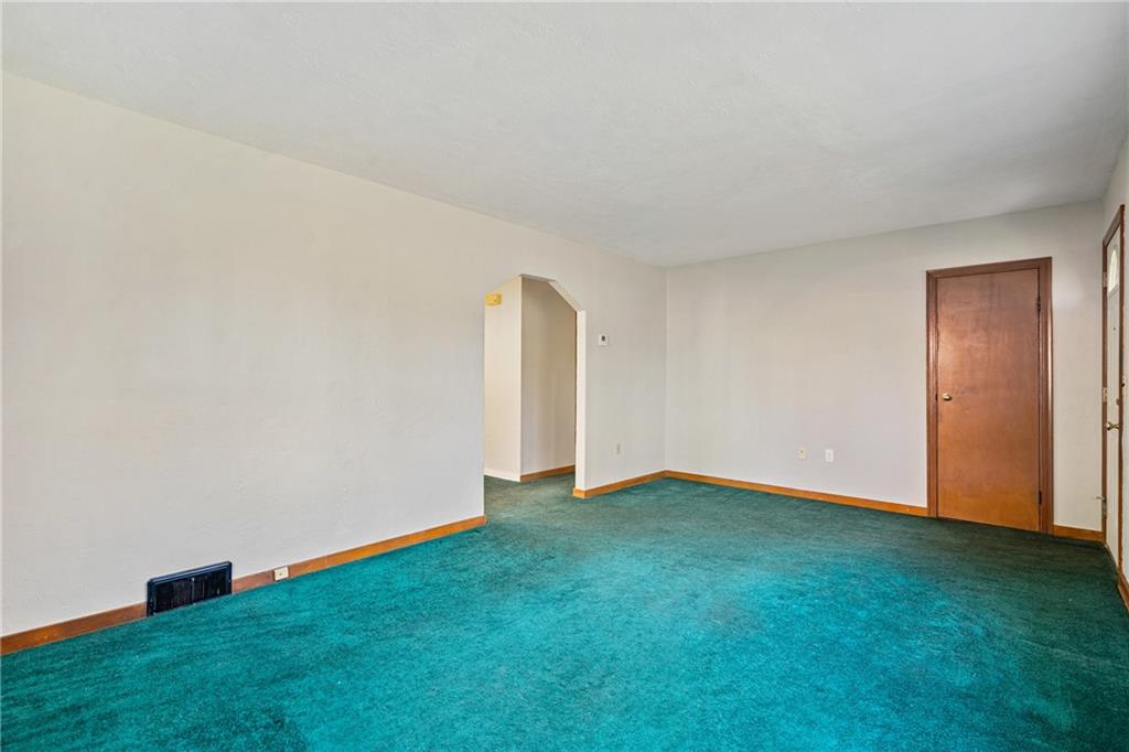 223 Oak Road Pittsburgh, PA 15239 - Photo 4 of 25 a view of an empty room with window