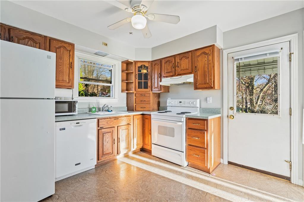 223 Oak Road Pittsburgh, PA 15239 - Photo 9 of 25 a kitchen with stainless steel appliances granite countertop a refrigerator and a stove top oven