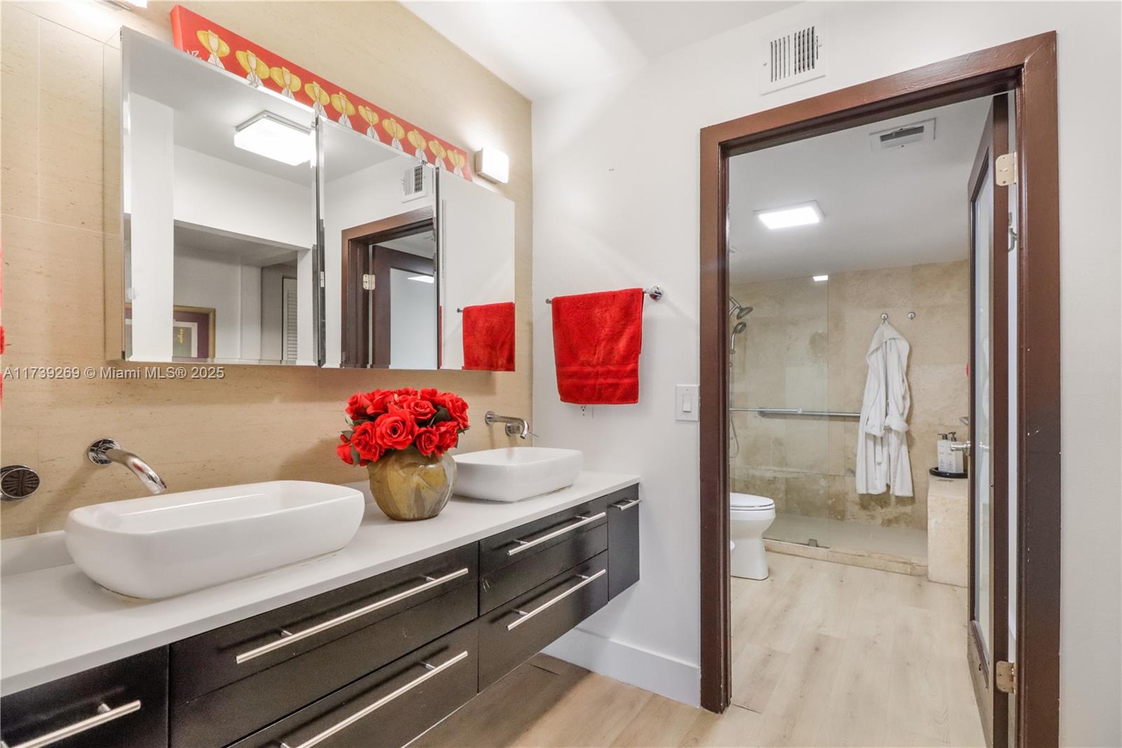 101 Ocean Ln Drive, Unit 1017 Key Biscayne, FL 33149 - Photo 12 of 25 a bathroom with a sink and a mirror