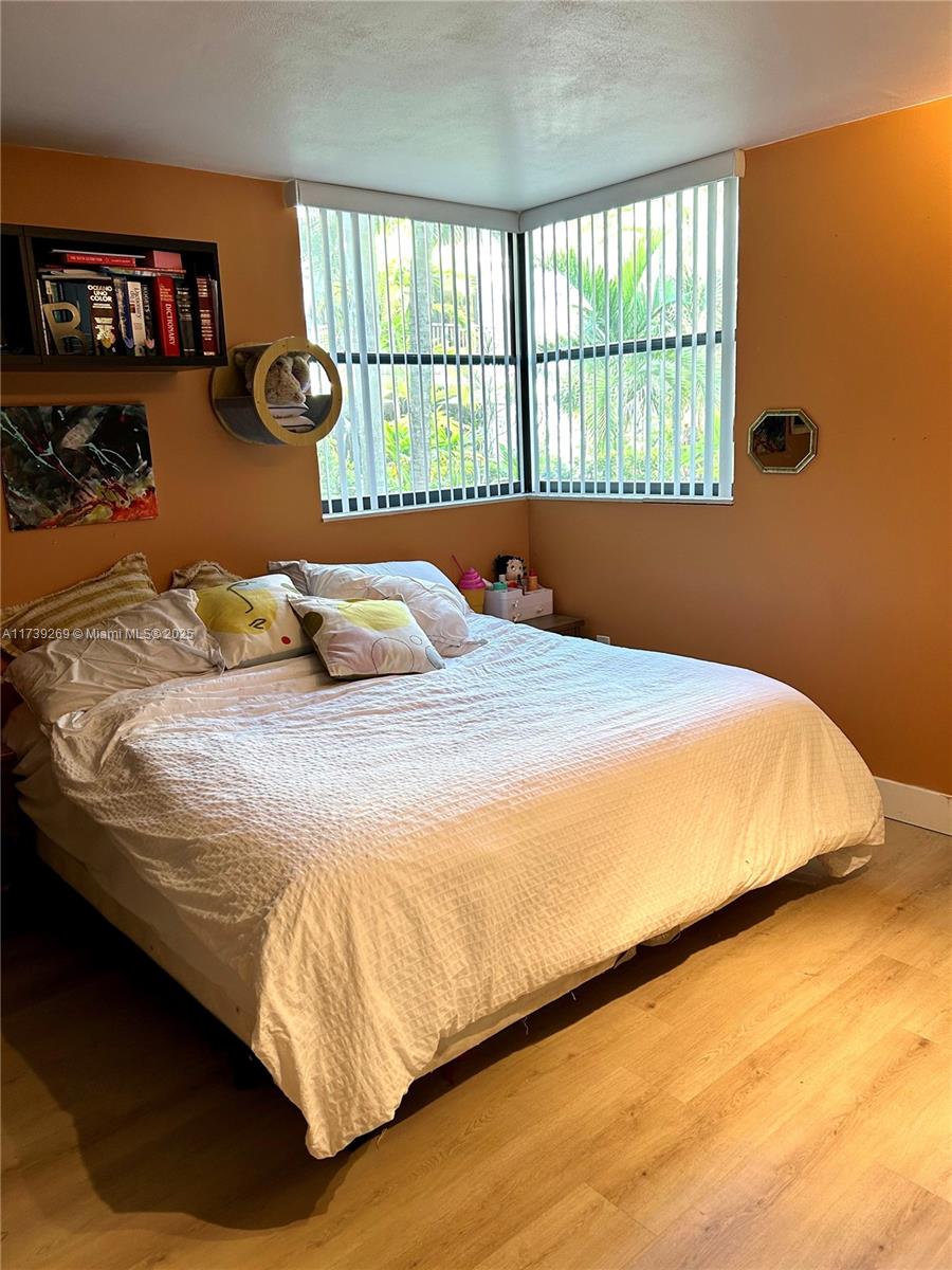 101 Ocean Ln Drive, Unit 1017 Key Biscayne, FL 33149 - Photo 16 of 25 a bedroom with a bed and window