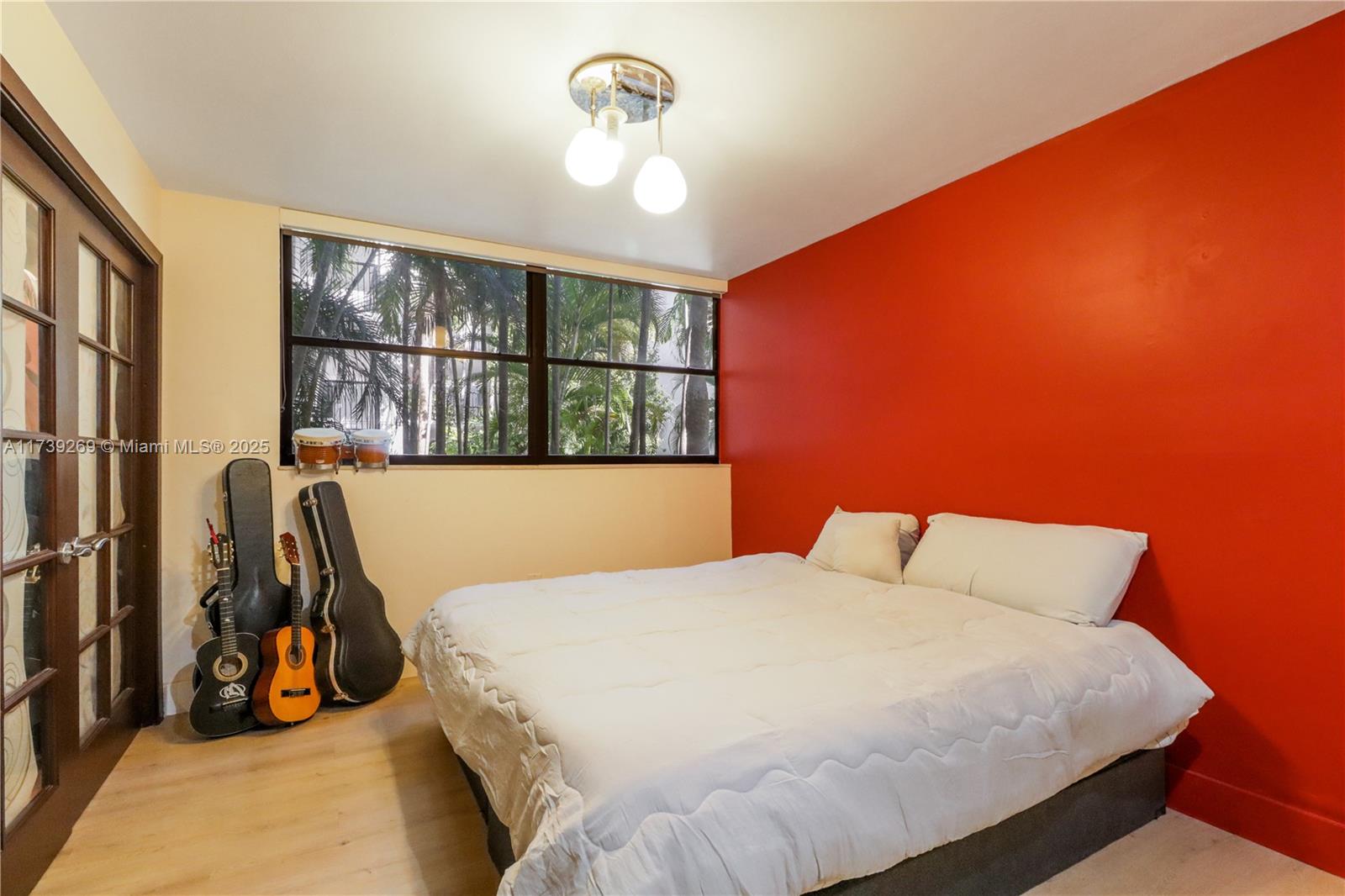 101 Ocean Ln Drive, Unit 1017 Key Biscayne, FL 33149 - Photo 17 of 25 a bedroom with a bed a couch and a window