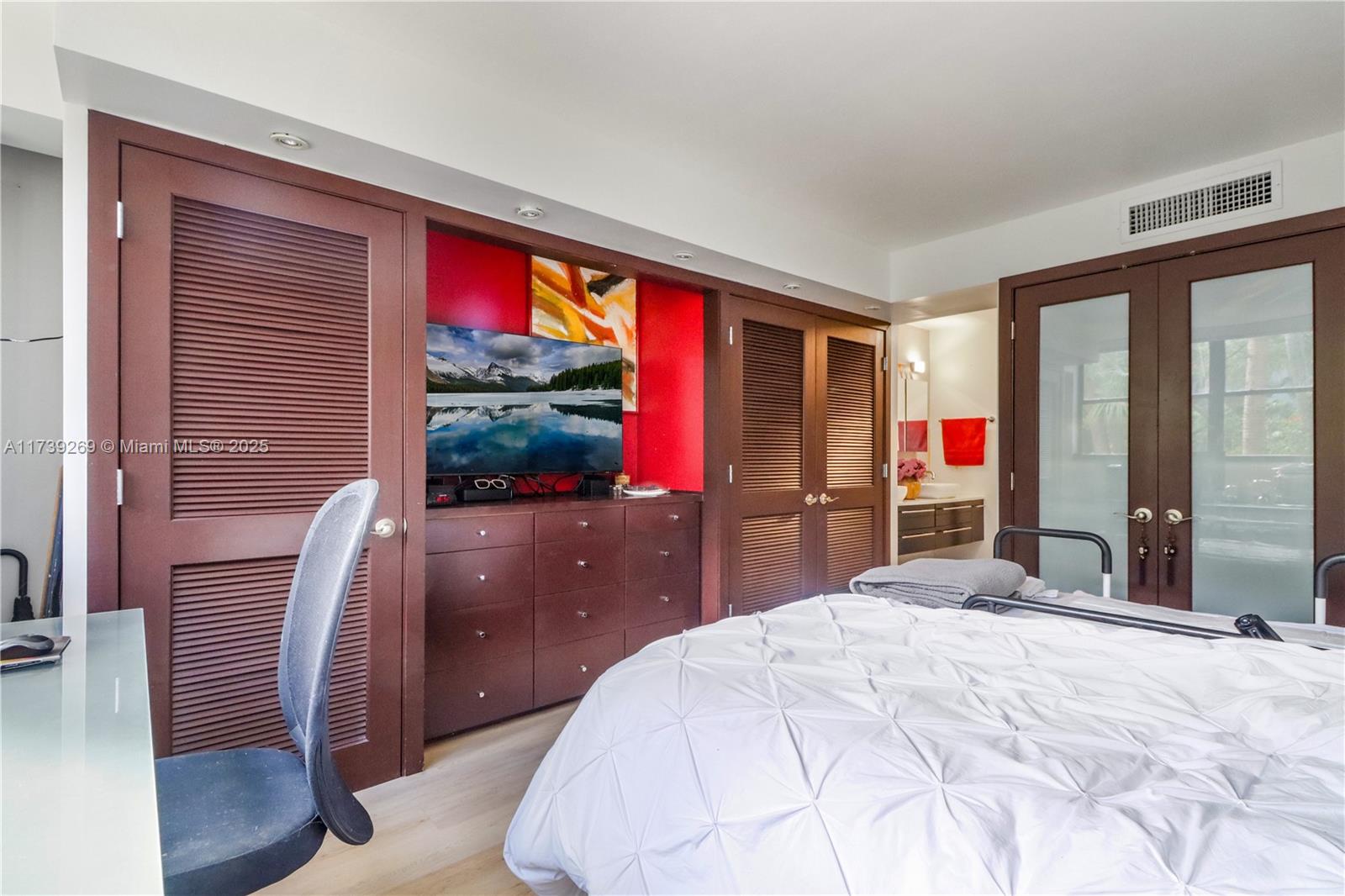 101 Ocean Ln Drive, Unit 1017 Key Biscayne, FL 33149 - Photo 10 of 25 a bed room with a bed and a flat screen tv