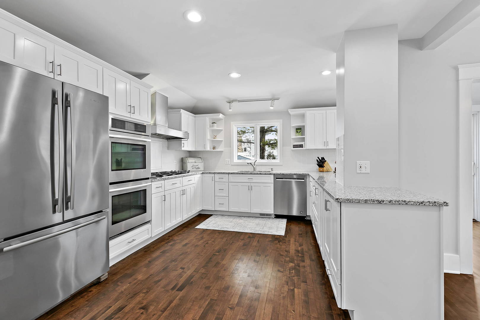 170 North Old Rand Road Lake Zurich, IL 60047 - Photo 12 of 34 a kitchen with a refrigerator a sink and cabinets
