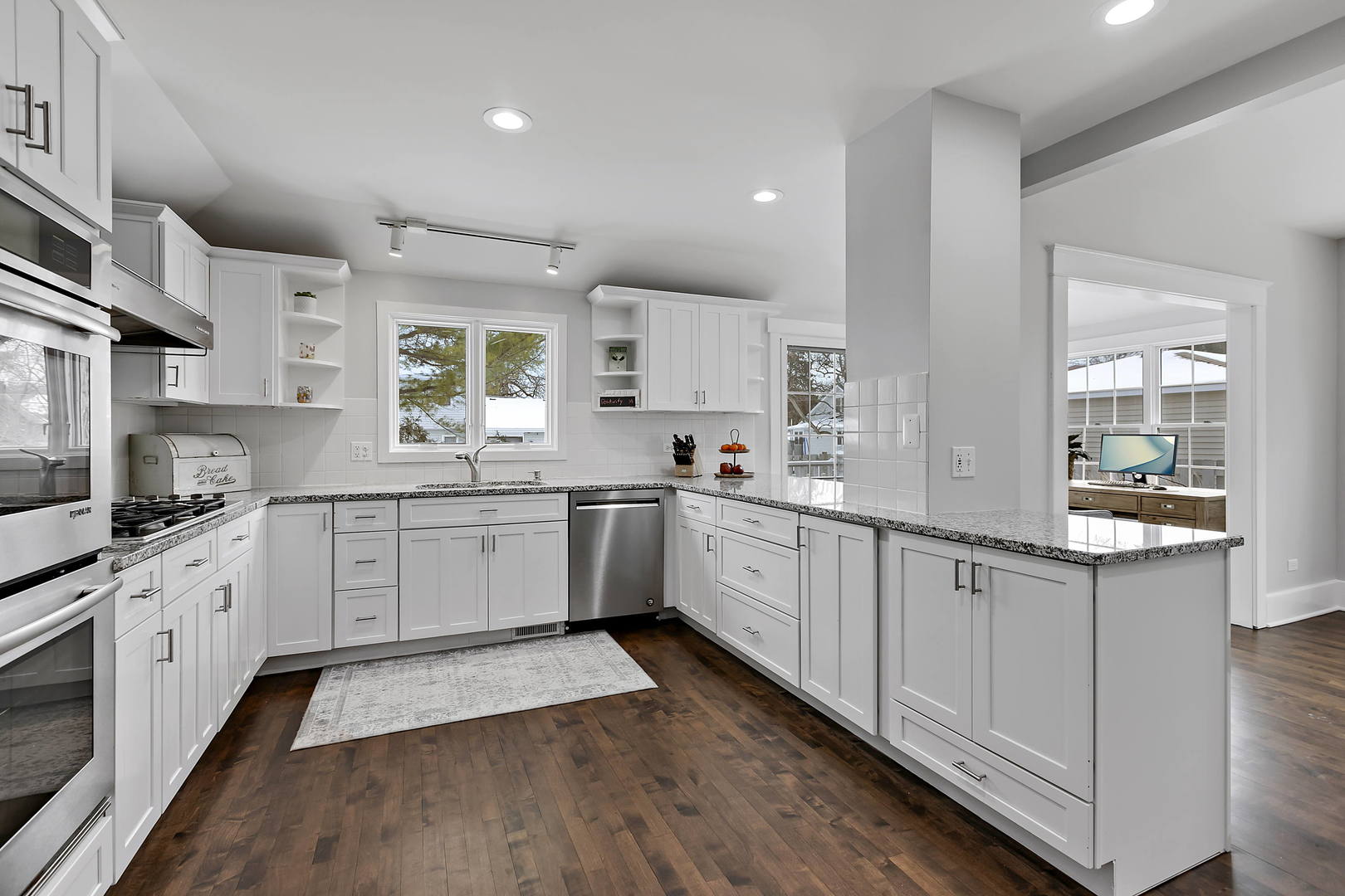 170 North Old Rand Road Lake Zurich, IL 60047 - Photo 13 of 34 a kitchen with granite countertop white cabinets and white appliances