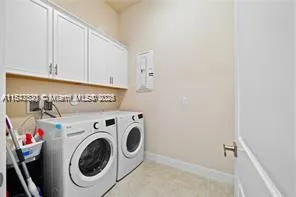 a living room with couches and a large window with garden view