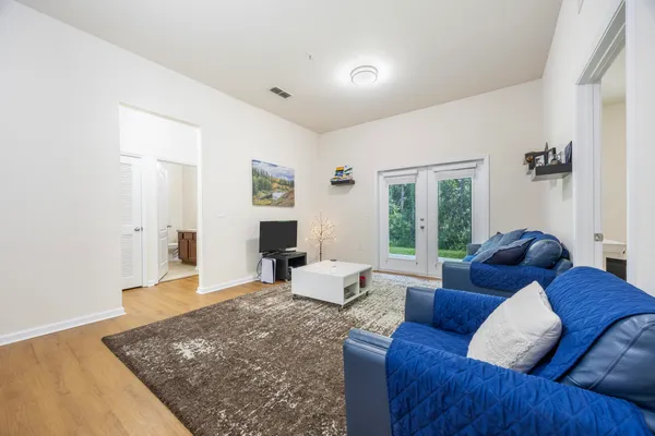 a living room with furniture and a rug
