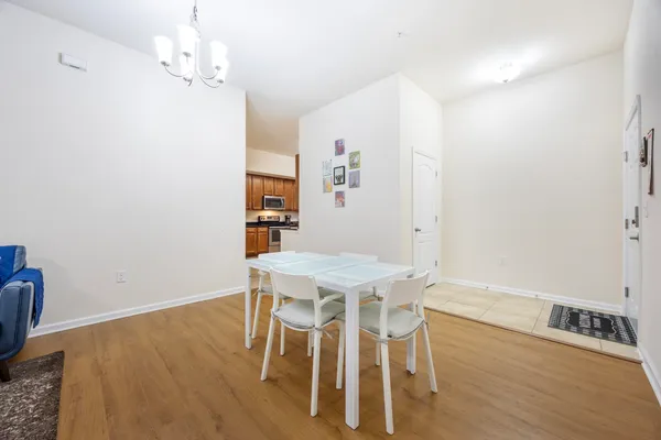 a view of a dining room with furniture and wooden floor