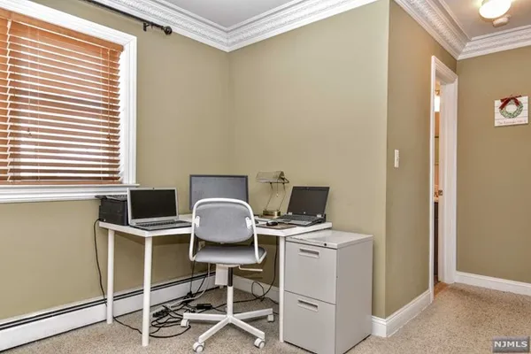 a view of workspace with wooden floor windows