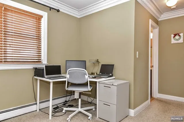 a view of workspace with wooden floor windows