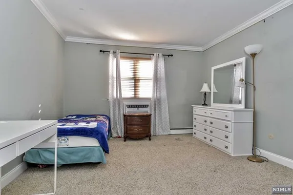 a bedroom with a bed and furniture