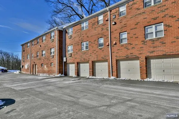 a front view of building with the street