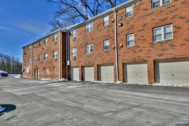 a front view of building with the street