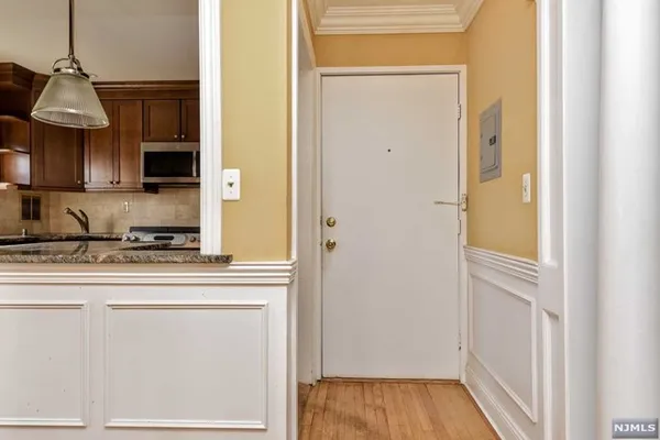 a kitchen with a refrigerator and cabinets
