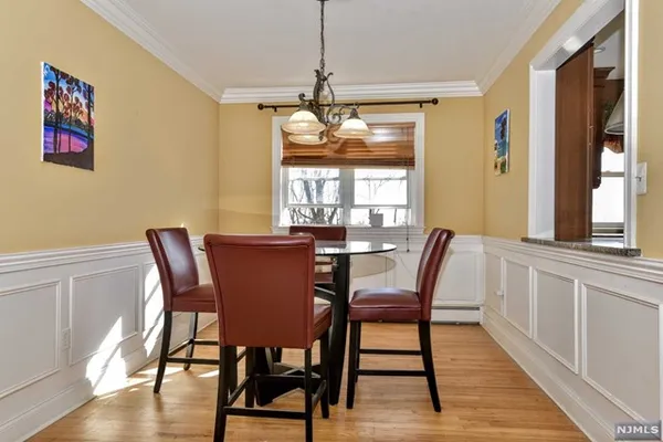 a dining room with furniture window wooden floor