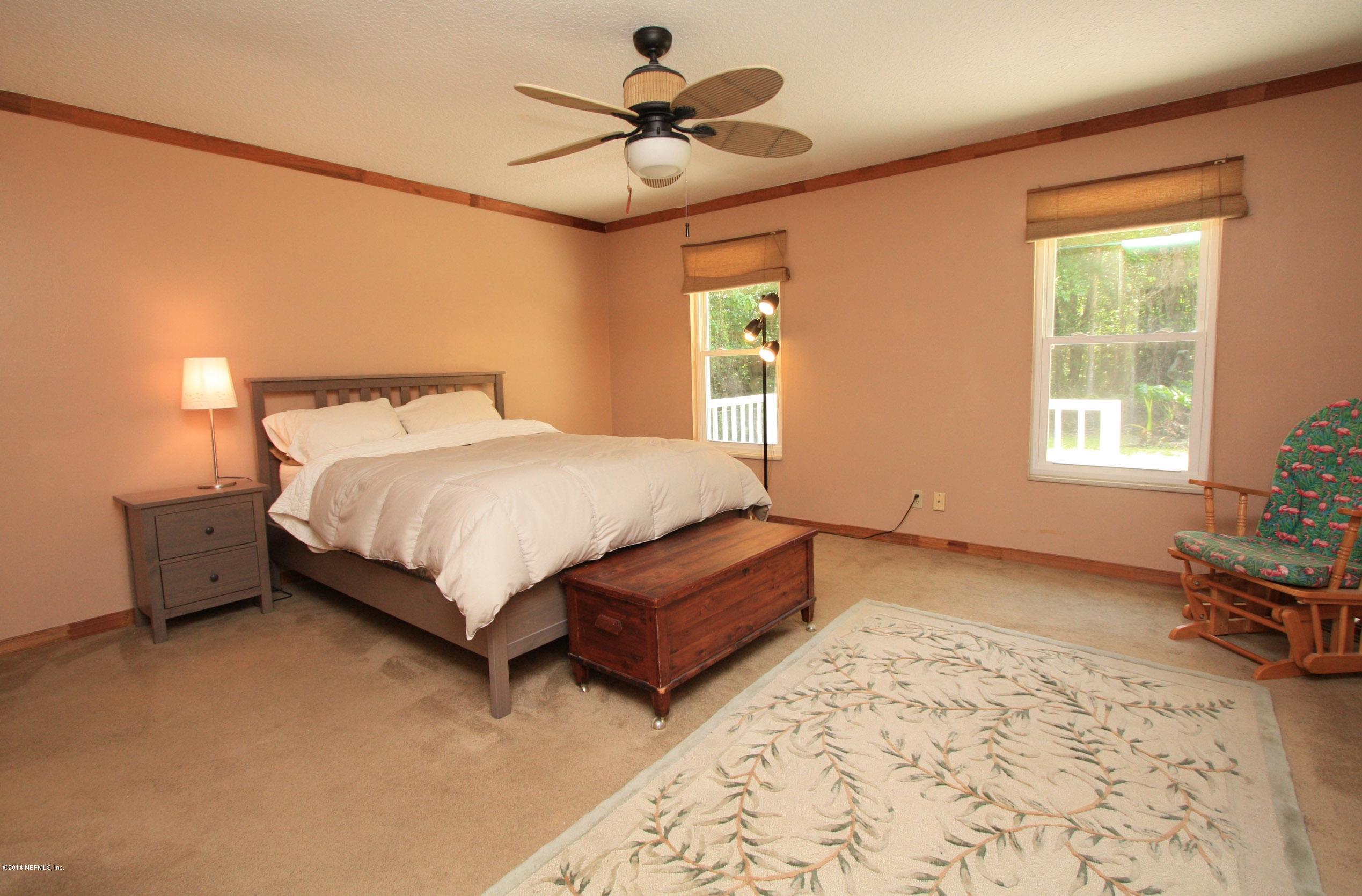 3028 Oak Road Orange Park, FL 32065 - Photo 11 of 31 a bedroom with a bed and window