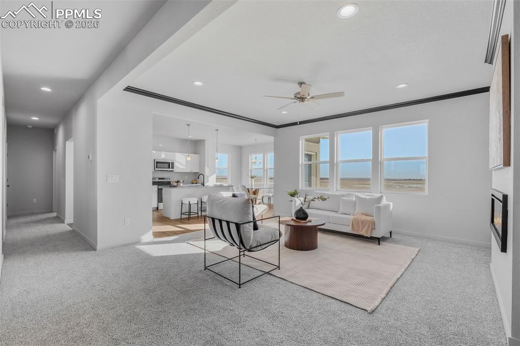 24515 Big Springs Road Calhan, CO 80808 - Photo 11 of 46 a living room with furniture and a large window