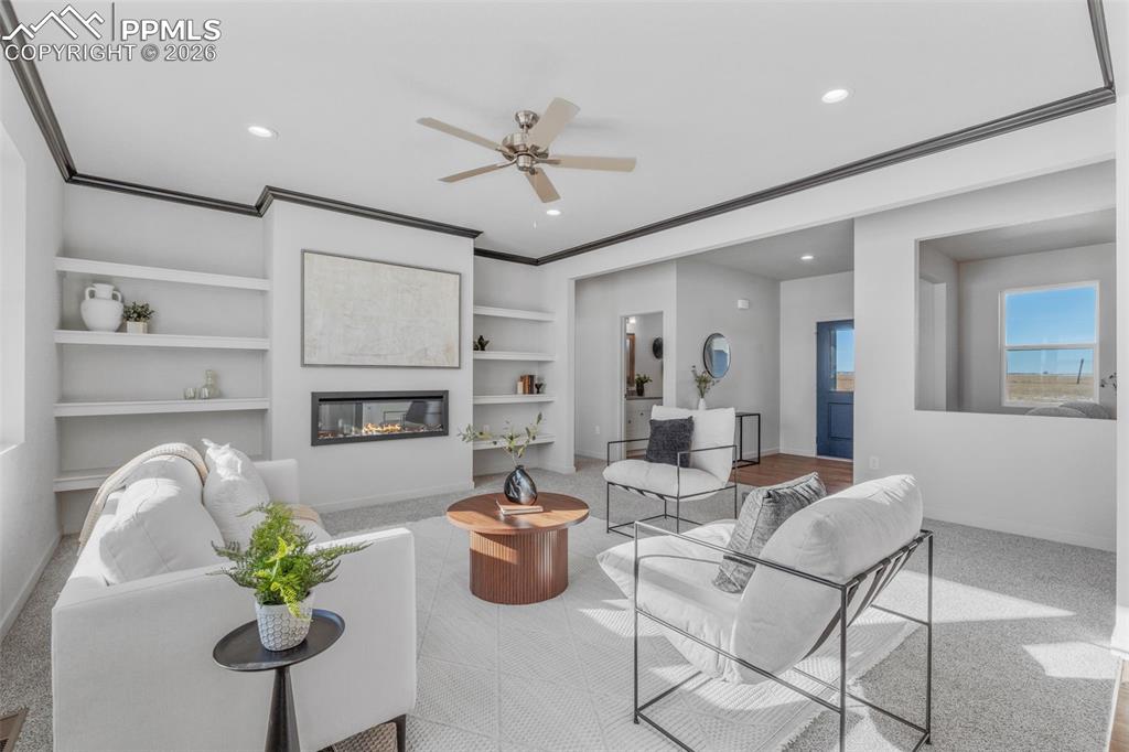 24515 Big Springs Road Calhan, CO 80808 - Photo 13 of 46 a living room with furniture a chandelier and a rug
