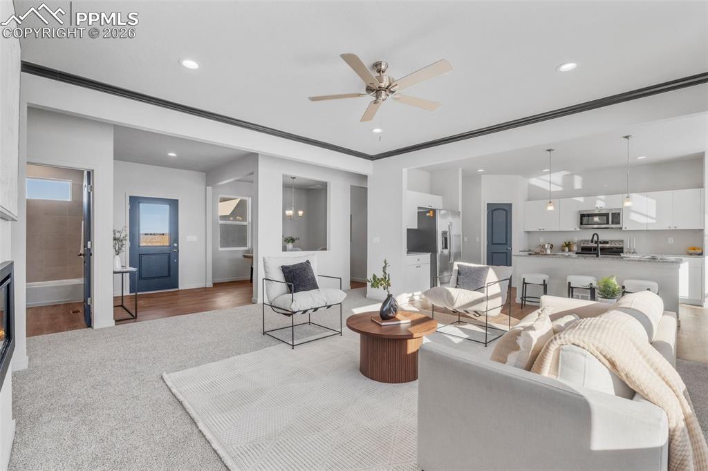 24515 Big Springs Road Calhan, CO 80808 - Photo 14 of 46 a living room with furniture a large window and stainless steel appliances