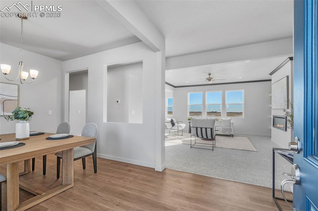 24515 Big Springs Road Calhan, CO 80808 - Photo 24 of 46 a view of a dining room with furniture window and wooden floor
