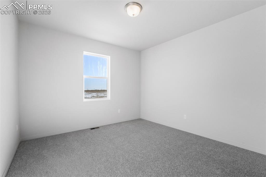 24515 Big Springs Road Calhan, CO 80808 - Photo 32 of 46 an empty room with a window