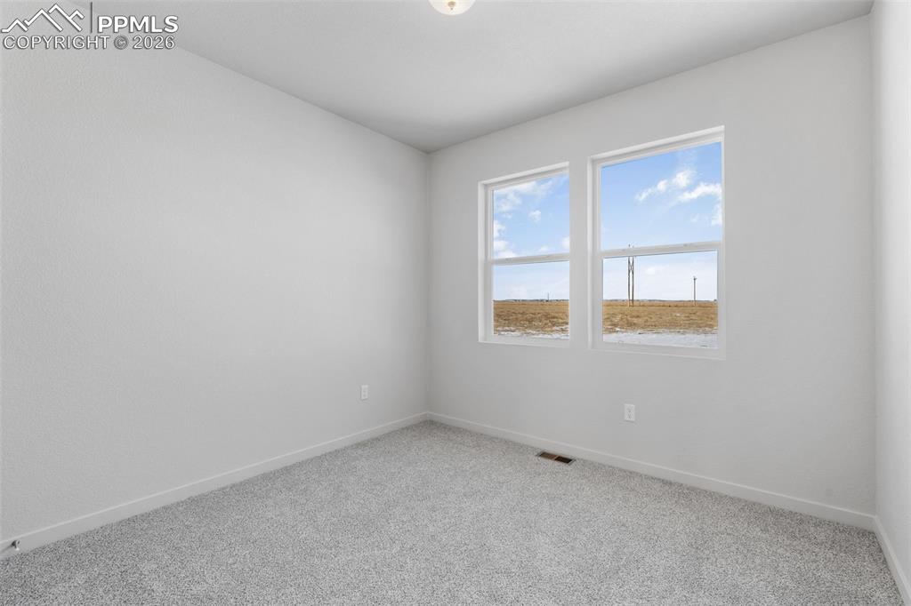 24515 Big Springs Road Calhan, CO 80808 - Photo 35 of 46 an empty room with a window