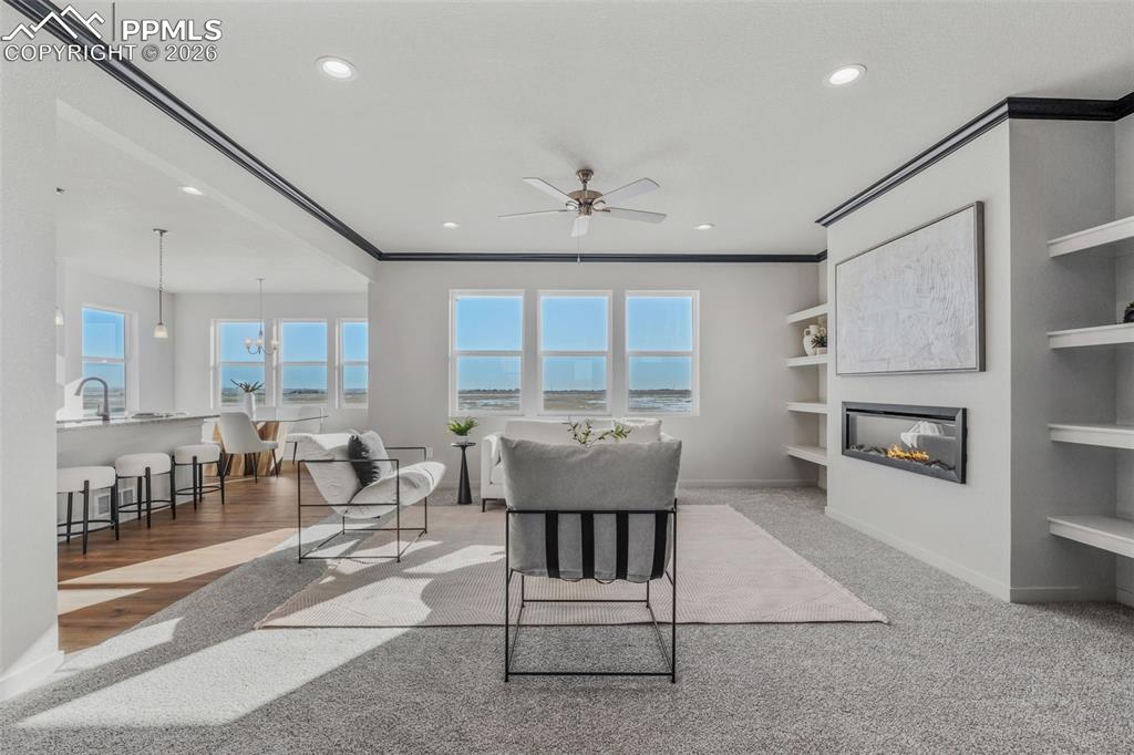 24515 Big Springs Road Calhan, CO 80808 - Photo 10 of 46 a view of a kitchen with furniture and a fireplace