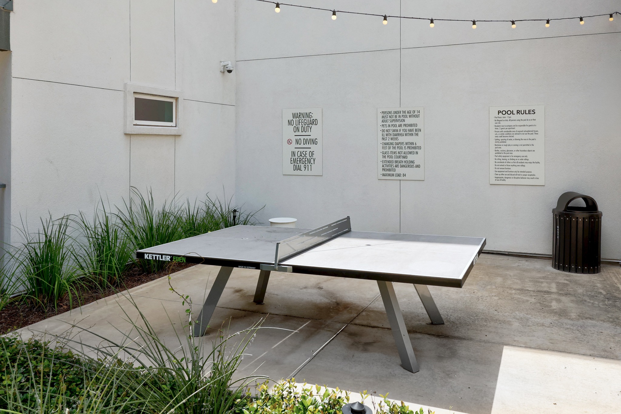 4801 Springdale Road, Unit 2301 Austin, TX 78723 - Photo 30 of 36 An inviting outdoor recreation area features a ping pong table, perfect for community enjoyment.