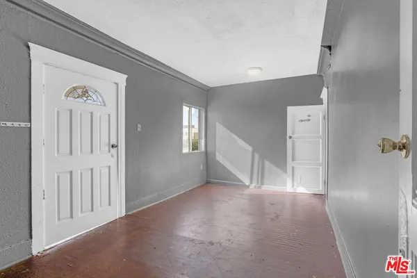 a view of hallway with wooden floor