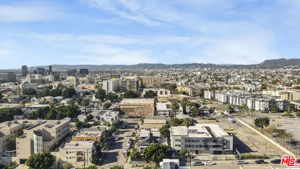 an aerial view of a city with lots of residential buildings