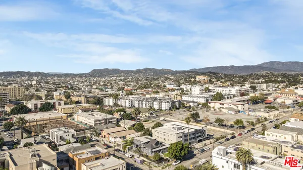 a view of a city with tall buildings in the background