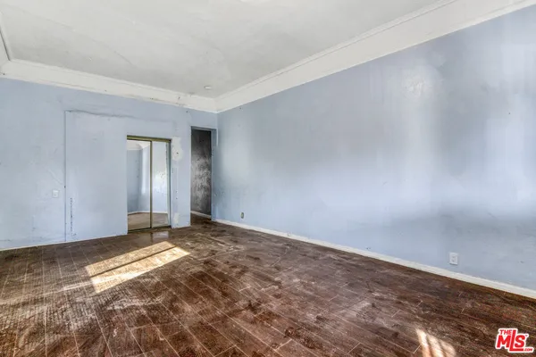 a view of an empty room and window
