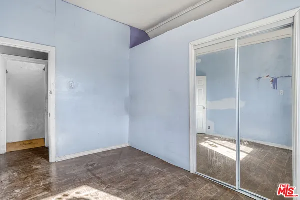 an empty room with sliding door