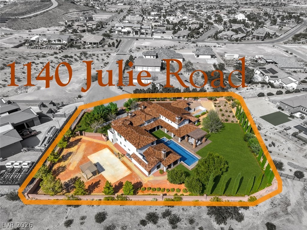 1140 Julie Road Henderson, NV 89002 - Photo 1 of 38 1140 JULIE RD HENDERSON NV 89002.
An aerial perspective showcases this amazing estate with sprawling layout, pristine pool & spa, sports court, gazebos, and inviting green spaces.