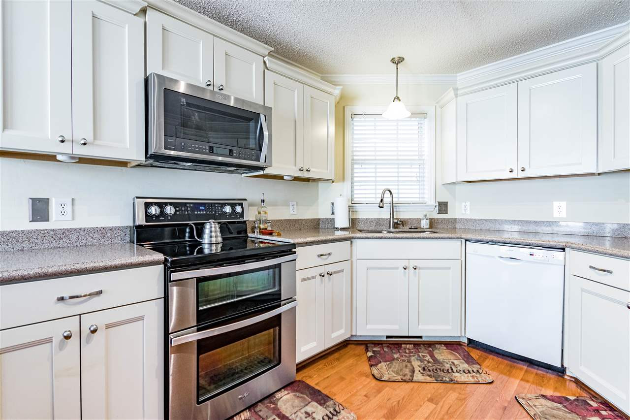4233 Fowler Ridge Drive Raleigh, NC 27616 - Photo 6 of 28 Updated with new soft close cabinetry. Quartz countertops and upgraded appliances Kitchen