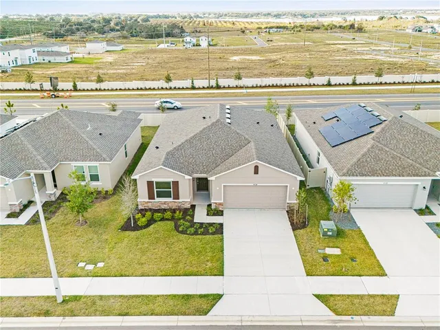 an aerial view of a house with a outdoor space