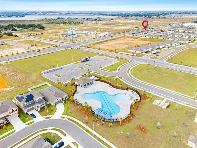 a view of swimming pool with outdoor seating and yard