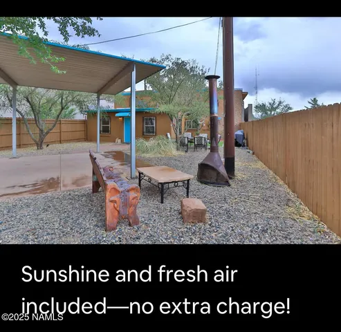 a view of swimming pool with a table and chairs